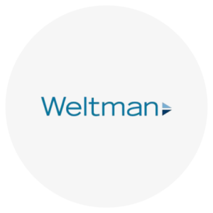 "Weltman" logo with a small triangular design to the right.